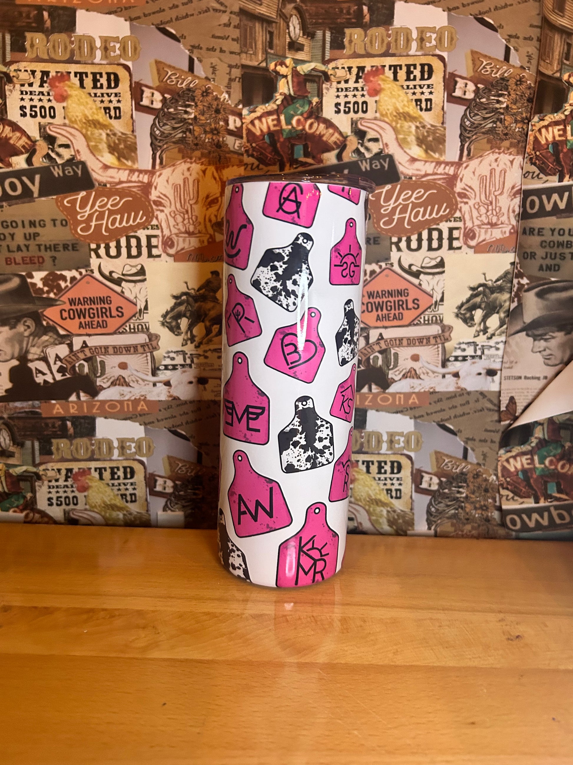Pink branded cow tag tumbler