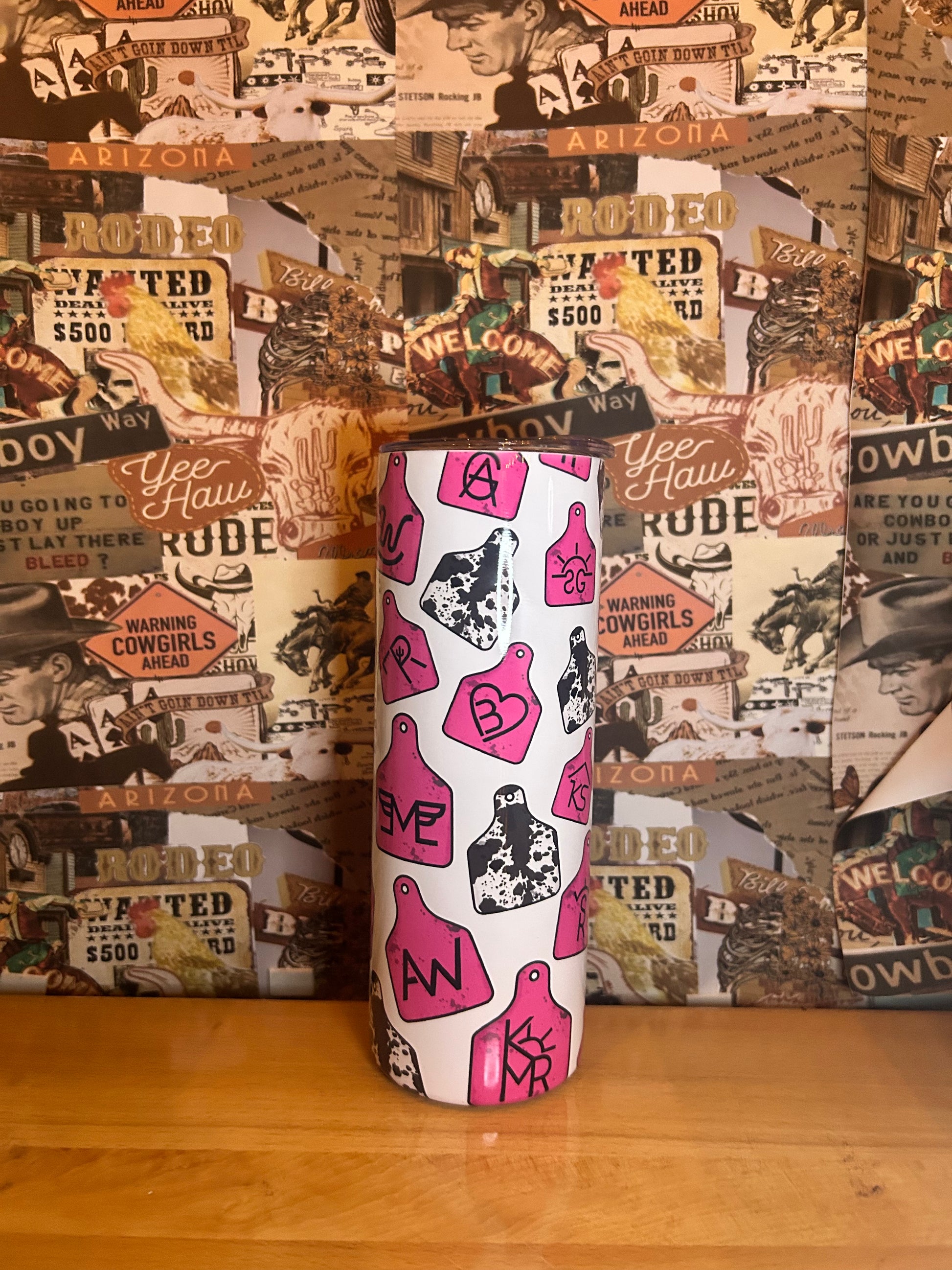 Pink branded cow tag tumbler